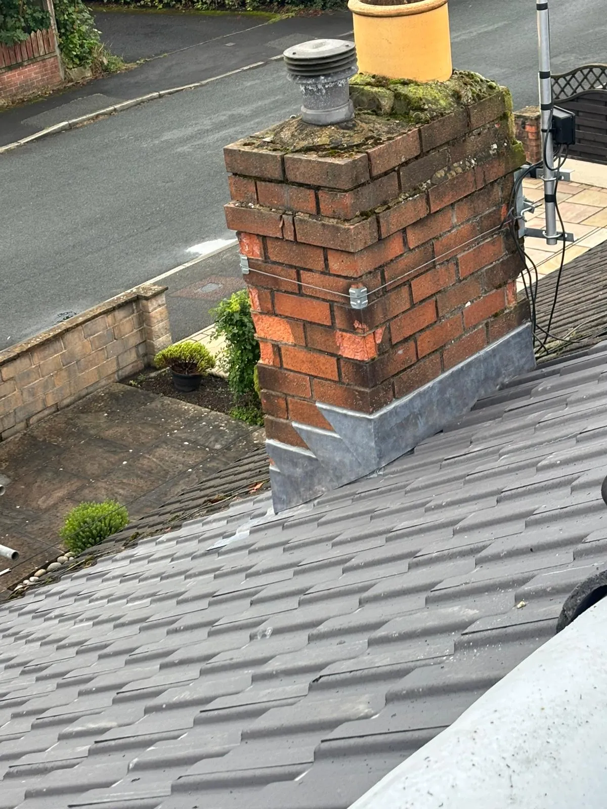 Tiled roof with chimney leadwork